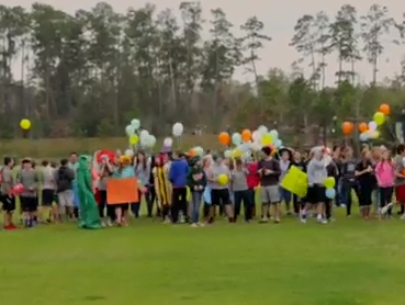 Junior high students host parade to help 'make the world more awesome'