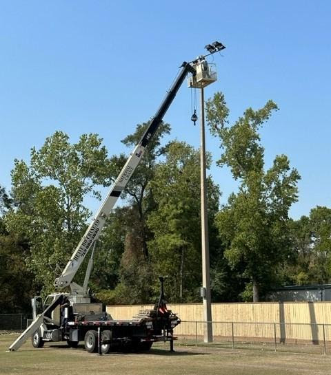 Precinct 3 crews install new lights for league ball fields