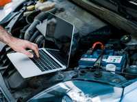 How do I inspect my vehicle’s battery before a trip?