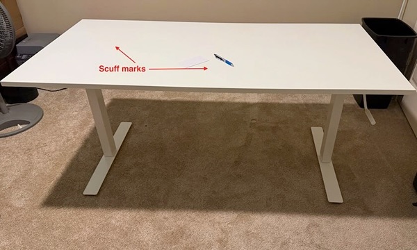 A white IKEA sit-stand desk