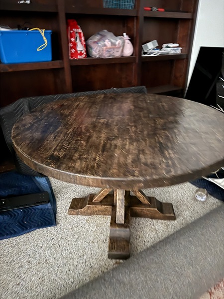 Brown solid wood round dining table