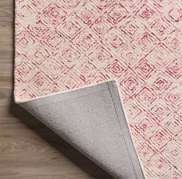wool rug with modern design, pops of pink color