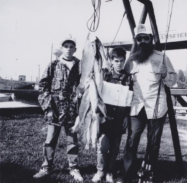 Jim Goode (far right) with son Levi (center)