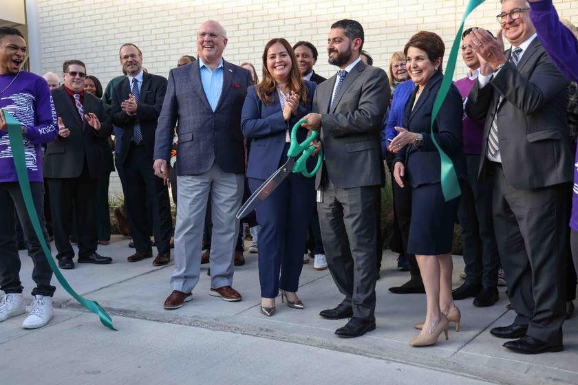 Lone Star College Chancellor Mario K. Castillo (center) cuts the ceremonial ribbon at the grand opening of LSC-University Park's Visual and Performing Arts Center. Castillo was joined by Harris County Pct. 3 Commissioner Tom Ramsey (far left), LSC Board of Trustee Miriam Saldivar (left), LSC-University Park President Virginia M. Fraire (right), NWHCC President & CEO Bobby Lieb (far right), and numerous faculty and staff. LSC-University Park students Elijah Pickney and Sara Tatar served as the ribbon holders.