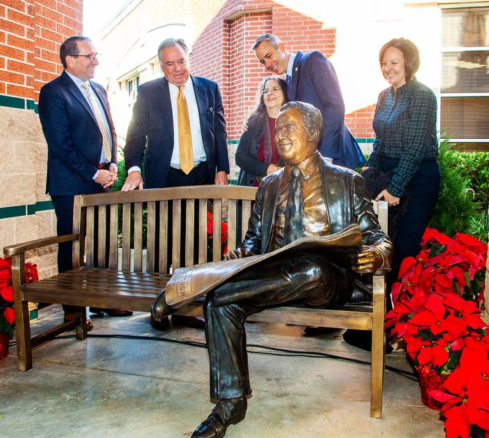 Conroe ISD Superintendent, Dr. Curtis Null; Bruce Tough; sculptor Bridgette Mongeon; Jim Carman, President Houston Region of Howard Hughes; and Coulson Tough Elementary Principal, Christina Julien unveil the sculpture of Coulson Tough, honoring the memory of the late community leader.