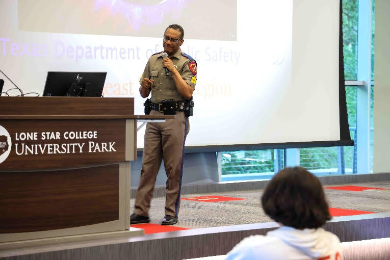 Sgt. Richard Standifer from the Texas Department of Public Safety engages with students at Lone Star College-University Park's True Crime Camp on April 3,2024, sharing insights from his extensive law enforcement career