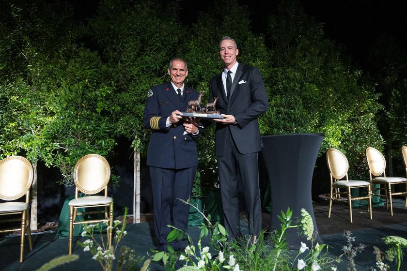 Accepting the Mitchell Award, Chief Palmer Buck Jim Carmen, Houston Region President, Howard Hughes