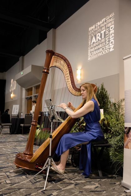 Harpist Laurie Meister performs during The Woodlands Fine Craft, Art & Design Show.