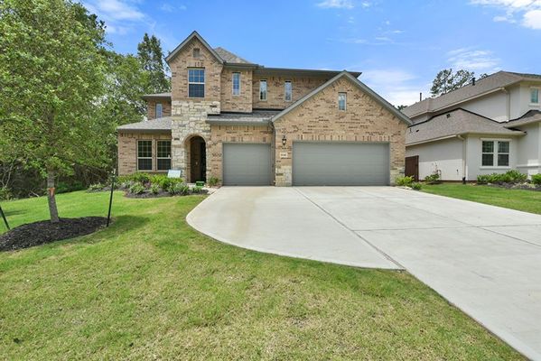 Front yard and exterior of 16146 Rustling Woods Rd