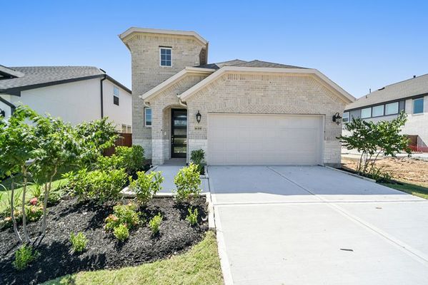 Front yard and exterior of 16319 Placid Stream