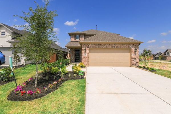 Front yard and exterior of 16334 Placid Stream